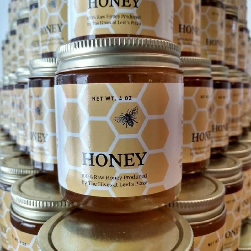 co-branded best bees honey with Levi's Plaza, honey jars stacked in a pyramid