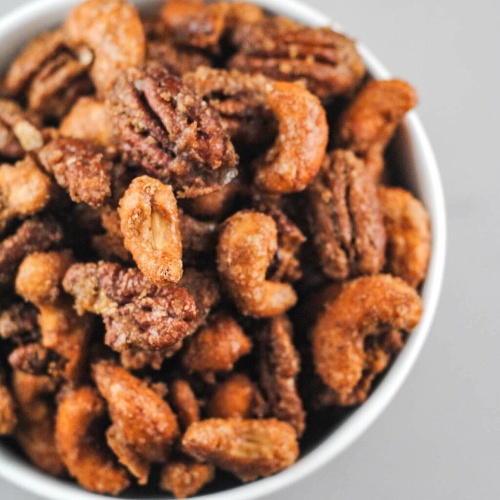 spiced nuts closeup in a white bowl