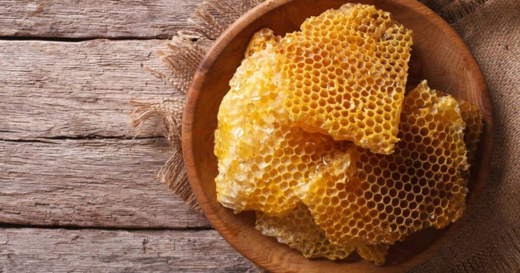 multiple slabs of honeycomb in a wooden bowl
