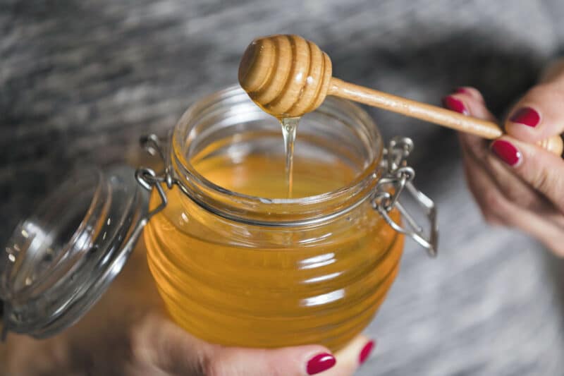 A jar of honey, pictured here, can be utilized to take advantage of the benefits of honey