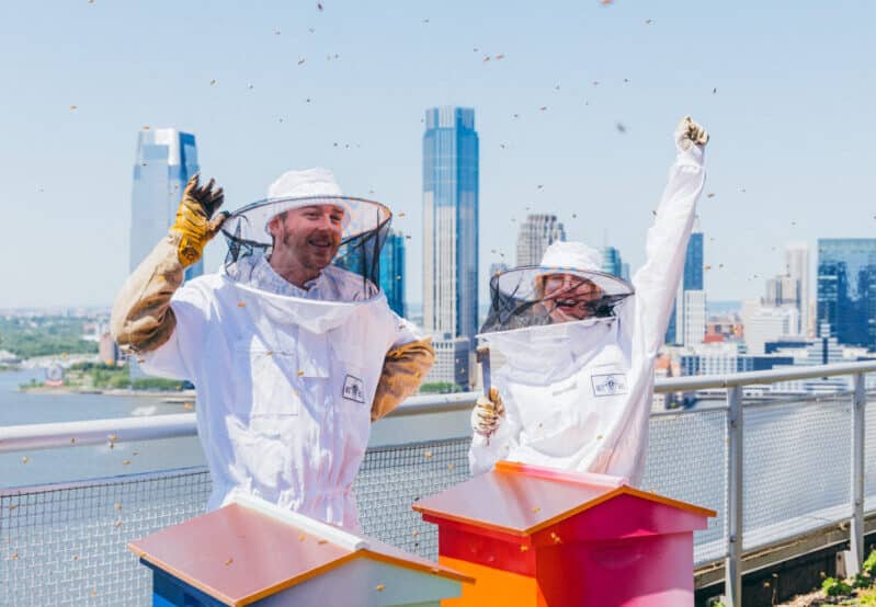 Best Bees beekeepers celebrate installing new beehives onto a rooftop in NYC