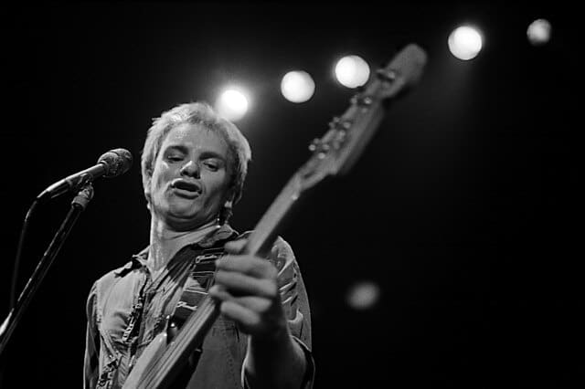 black and white photo of Sting from the Police in concert