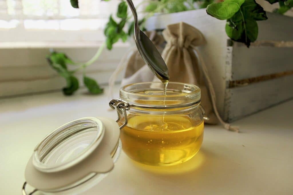 the benefits of honey, like this jar of honey pictured here, include its anti-inflammatory properties