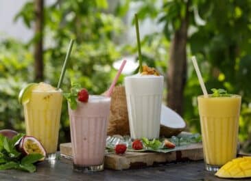 four different smoothies on a table