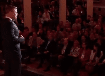 noah in front of the crowd at his Boston TED talk